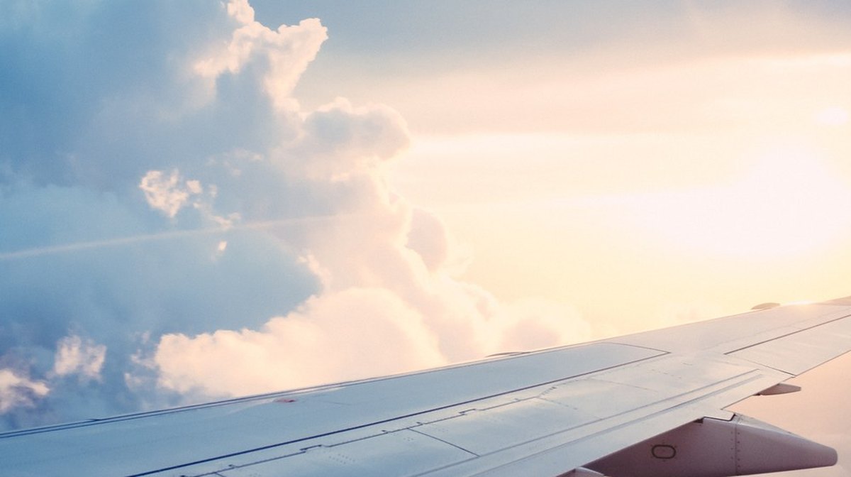 Airplane wing above the clouds